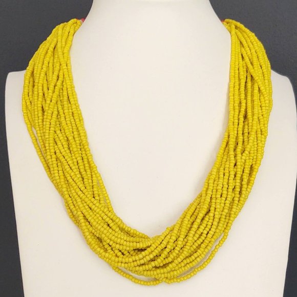 Jewelry - Layered yellow beaded necklace with old coin toggle closure